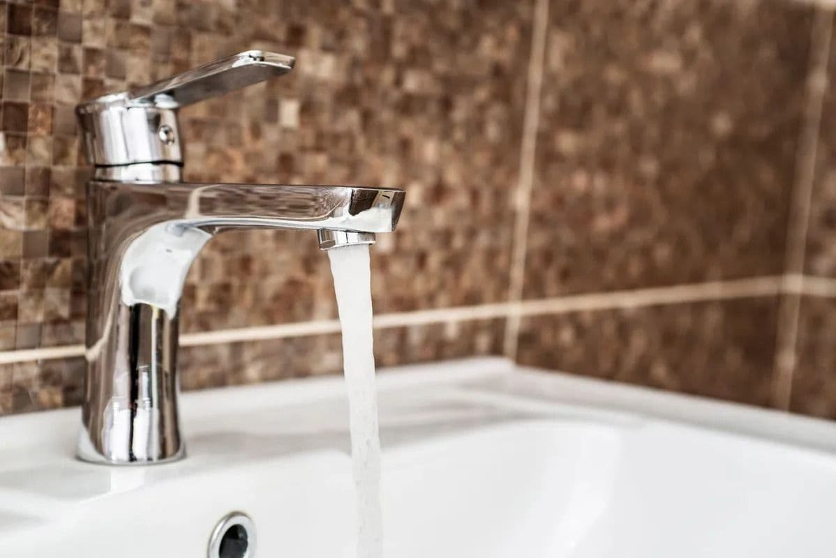 Faucet running with water